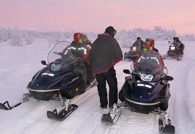 High mountain overnight tour with snowmobile